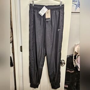 Nike loose fit mid rise full length jogger pants black womens size medium NEW